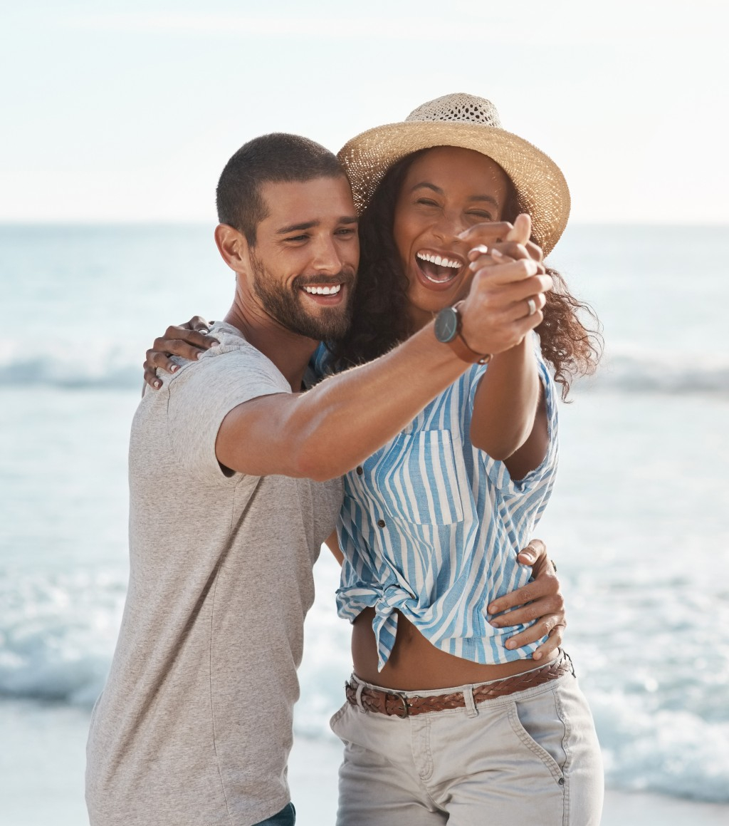 Image of a couple having fun on a beach