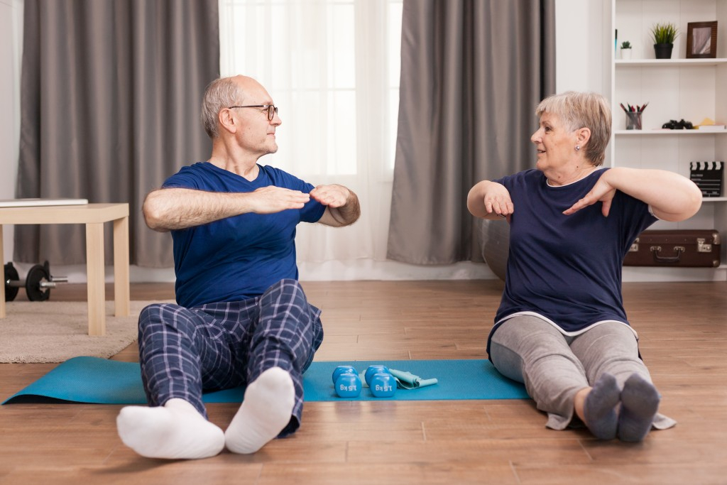 Senior Couple Exercising for Back Pain